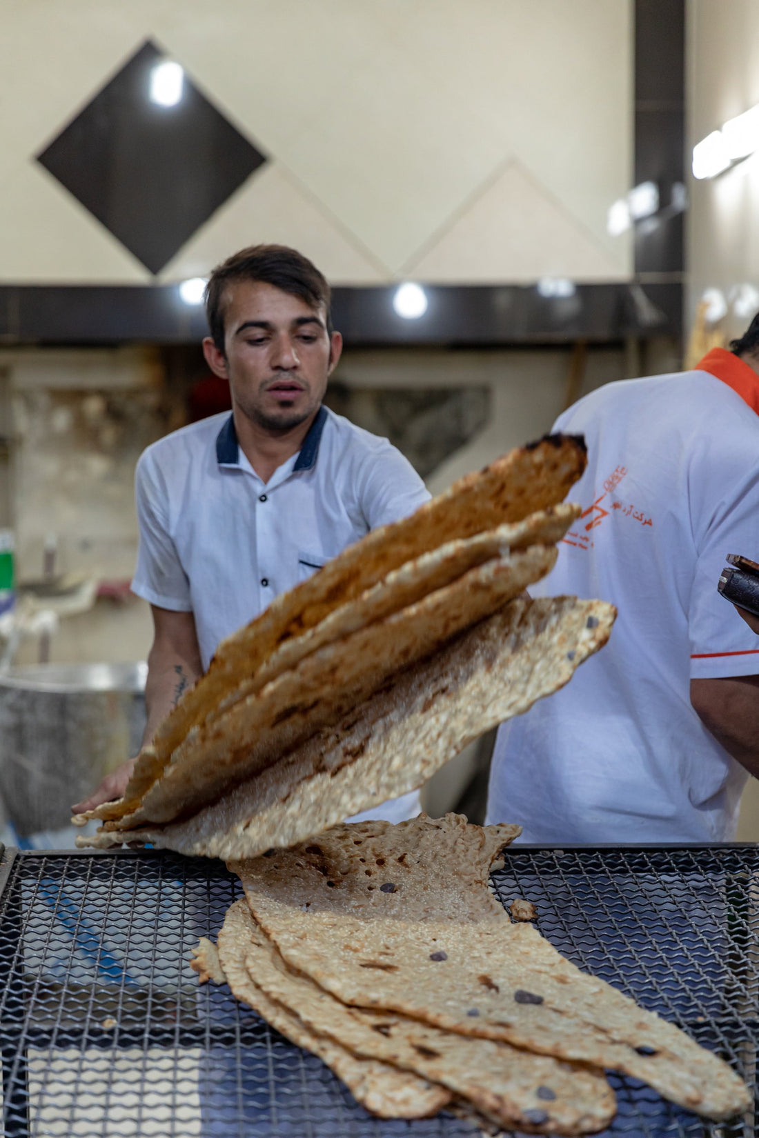 Fresh sangak bread at a bakery in Tehran, photographed by Ninara in 2018